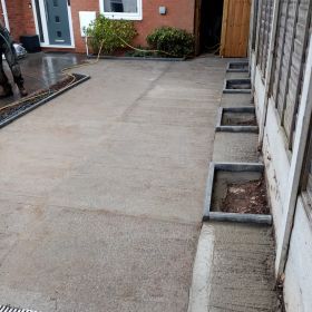 Small driveway. Dug out grass sectioned area and laid road stone and concrete : Click Here To View Larger Image